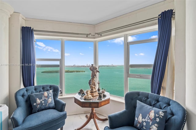 sitting room featuring a water view