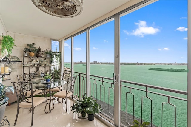 sunroom with a water view