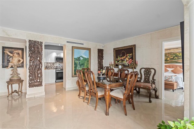 tiled dining space featuring tile walls