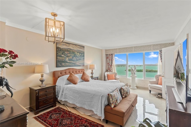 bedroom featuring an inviting chandelier, a water view, and ornamental molding