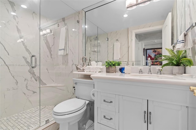 bathroom featuring vanity, toilet, and an enclosed shower