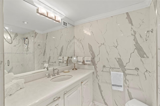 bathroom featuring vanity, a shower with door, toilet, and tile walls