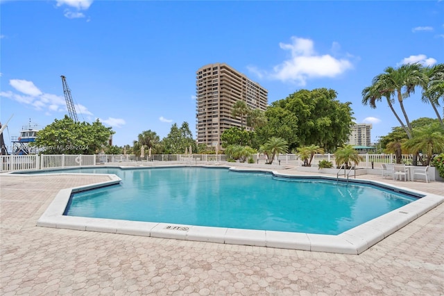 view of swimming pool featuring a patio area