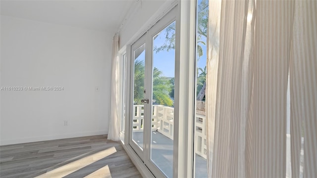 entryway with hardwood / wood-style flooring