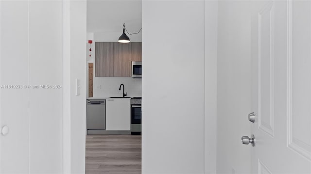 interior space featuring light hardwood / wood-style floors and sink