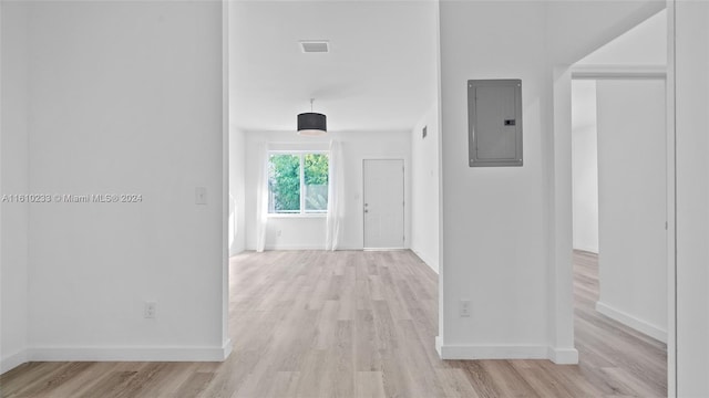 hall with electric panel and light wood-type flooring