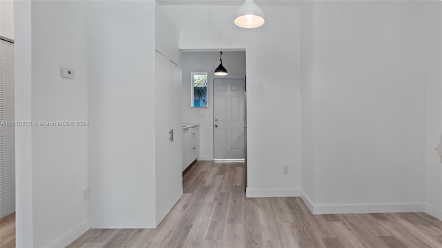 corridor featuring light wood-type flooring