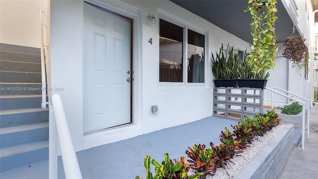 view of exterior entry featuring a porch