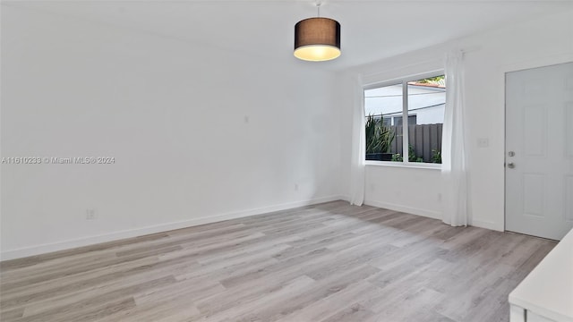 empty room with light wood-type flooring