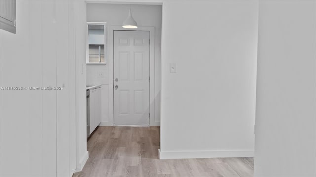 corridor featuring light hardwood / wood-style floors