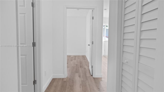 hall with light hardwood / wood-style floors