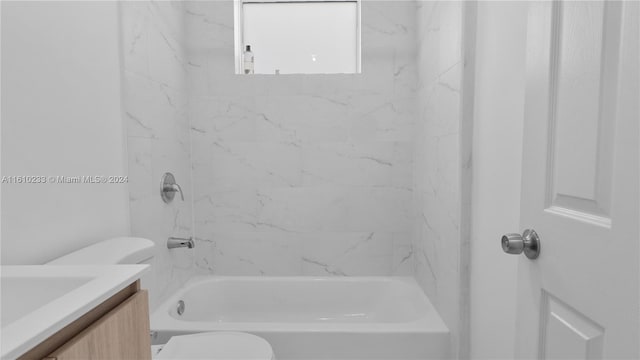 full bathroom with vanity, toilet, and tiled shower / bath combo