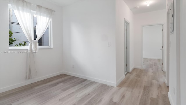 spare room featuring light hardwood / wood-style floors