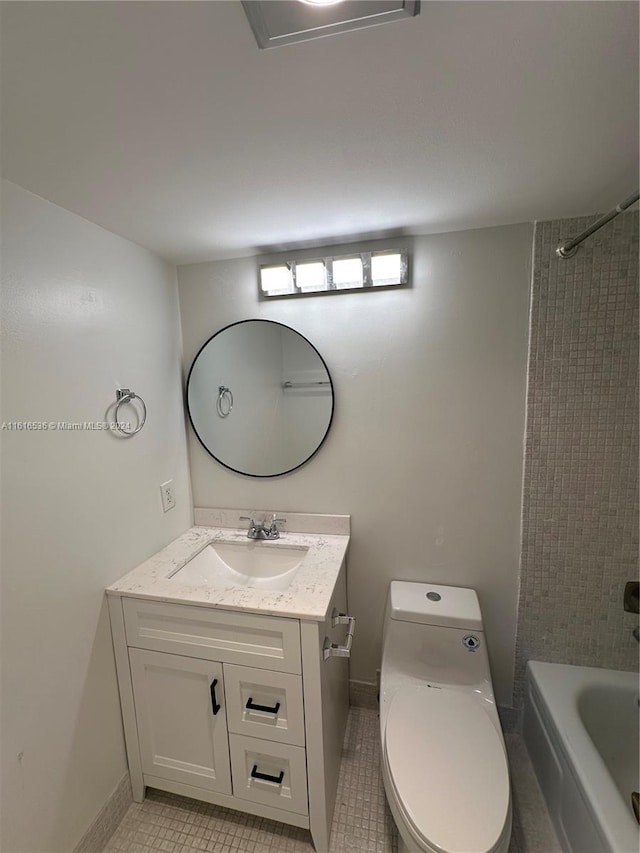 full bathroom with toilet, vanity, tile patterned floors, and tiled shower / bath combo