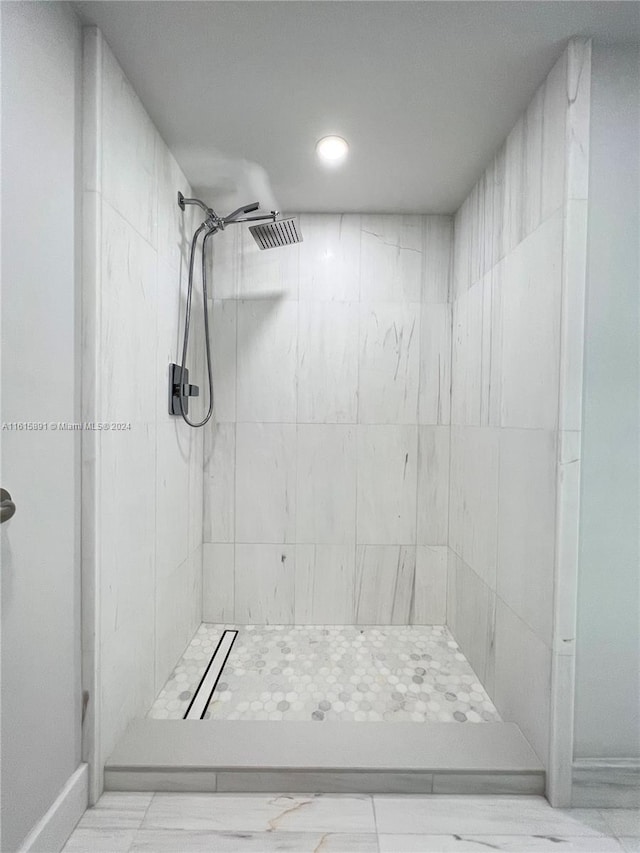 bathroom with a tile shower