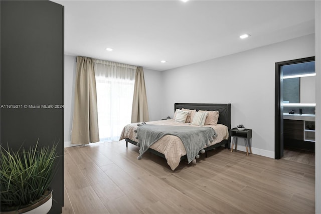 bedroom with light wood-type flooring