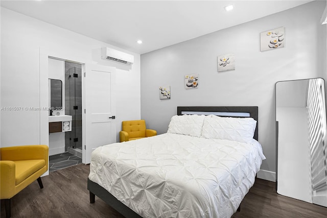 bedroom featuring dark wood-type flooring, a closet, a wall mounted AC, and ensuite bathroom