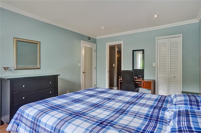 bedroom featuring ornamental molding and a closet