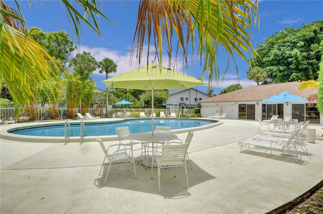 view of swimming pool with a patio area