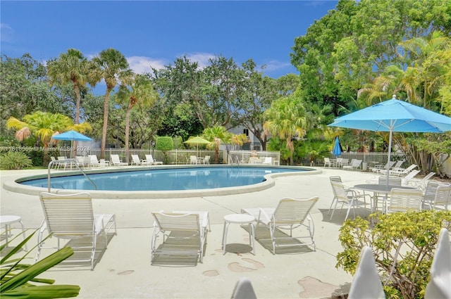 pool featuring a patio and fence