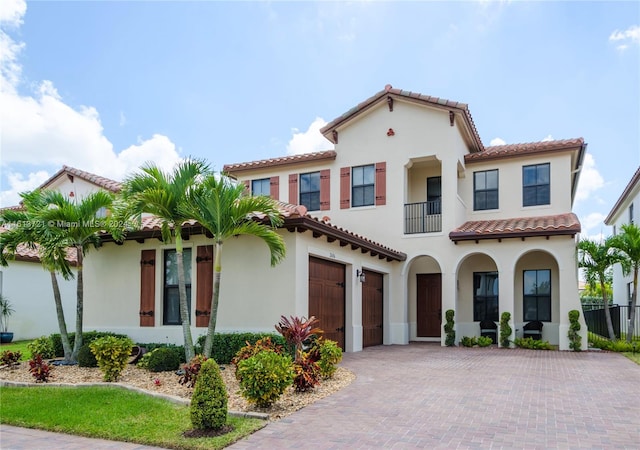 mediterranean / spanish-style house featuring a garage