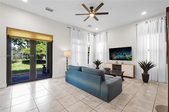 tiled living room featuring ceiling fan