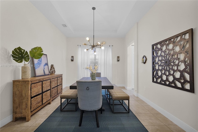 dining room featuring light tile patterned floors and a chandelier