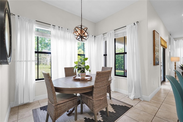 tiled dining area with a chandelier