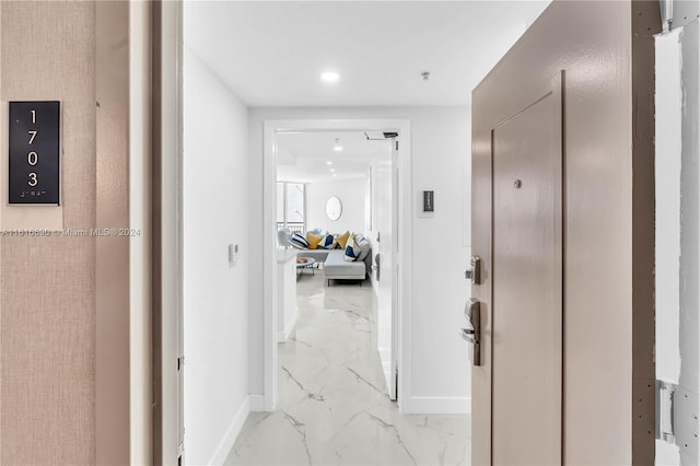 hallway with light tile patterned floors