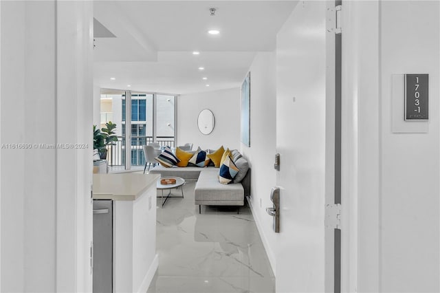 hall with light tile patterned floors