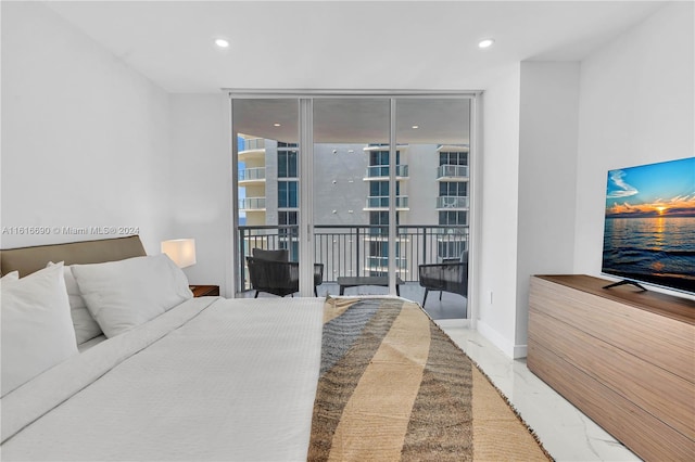 bedroom with floor to ceiling windows and access to outside