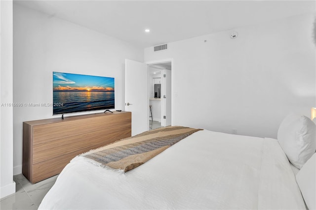 bedroom featuring light tile patterned floors