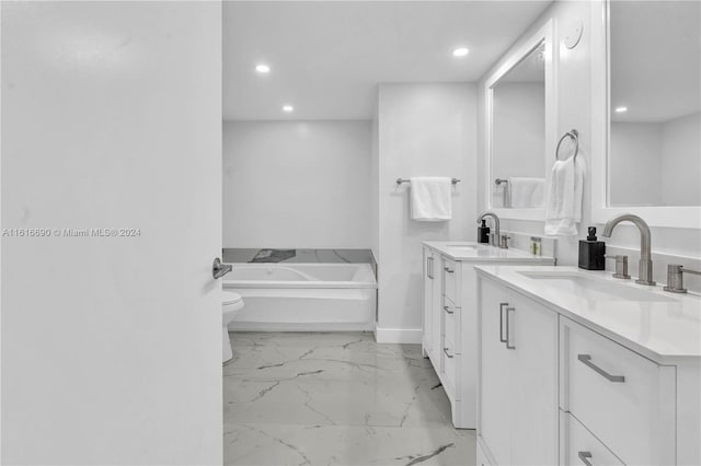 bathroom with a bathtub, tile patterned floors, dual vanity, and toilet