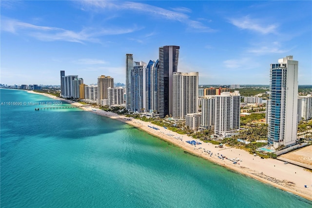 aerial view featuring a water view and a view of the beach