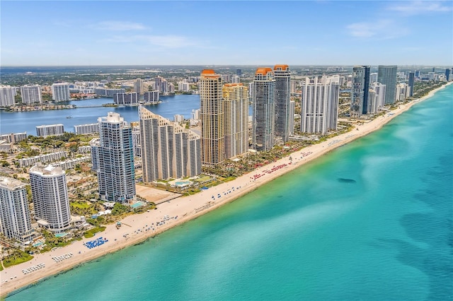 bird's eye view featuring a water view and a view of the beach