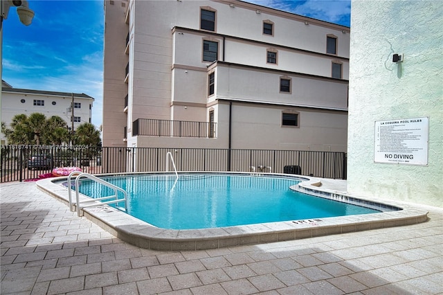 view of pool featuring a patio area