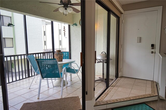 sunroom / solarium with ceiling fan