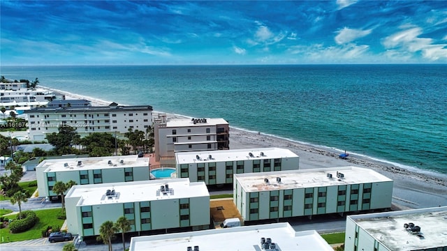 bird's eye view featuring a view of the beach and a water view