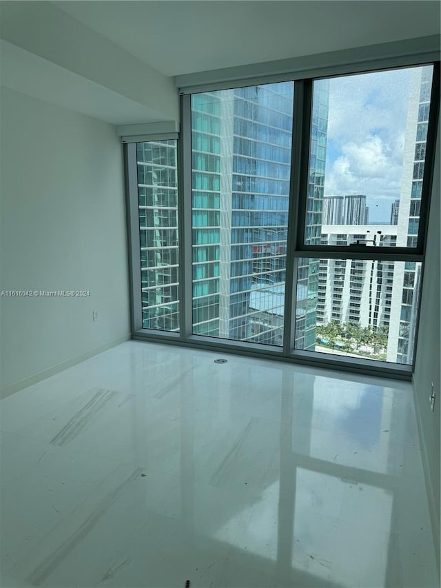 spare room featuring floor to ceiling windows