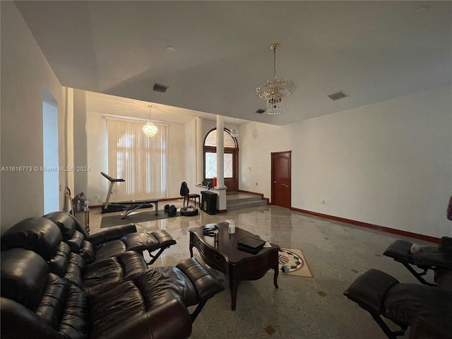 living room featuring a notable chandelier