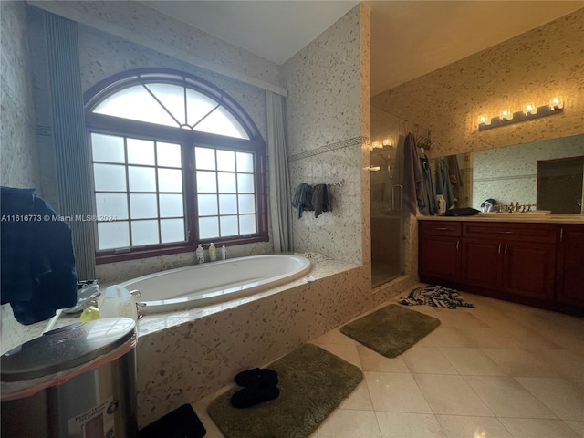 bathroom featuring vanity, shower with separate bathtub, and tile patterned floors