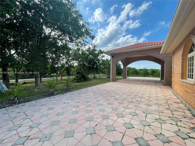 31002 SW 212th Ave, Homestead, FL 33030 - view of patio featuring decorative driveway
