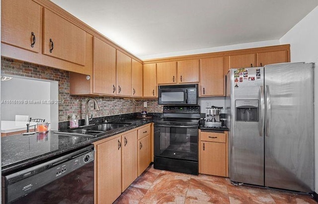 kitchen with sink, tasteful backsplash, dark stone countertops, and black appliances