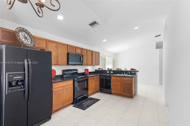 kitchen with a notable chandelier, light tile patterned floors, kitchen peninsula, black appliances, and sink