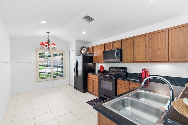 kitchen with black appliances, hanging light fixtures, sink, lofted ceiling, and light tile patterned floors