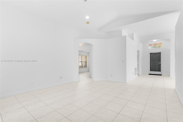 unfurnished room featuring light tile patterned floors