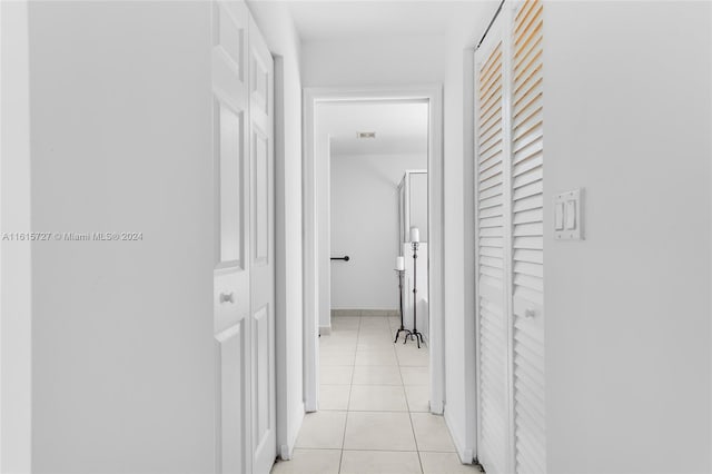 hall with light tile patterned flooring