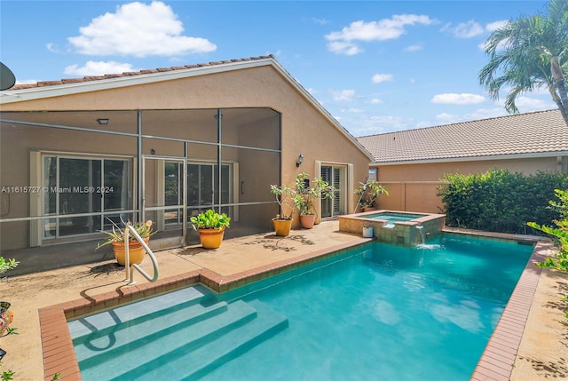 view of pool with an in ground hot tub and a patio