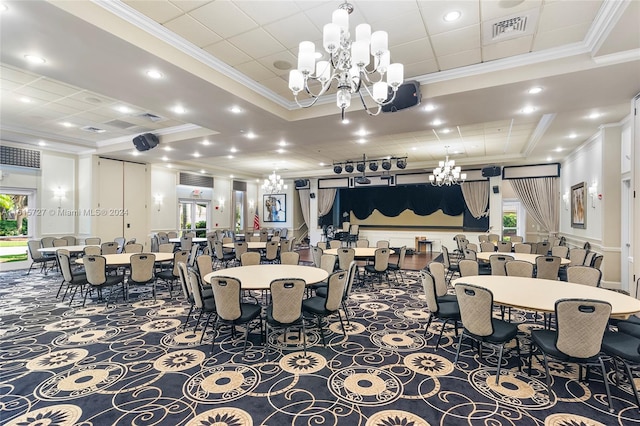 dining area with an inviting chandelier, crown molding, and a raised ceiling