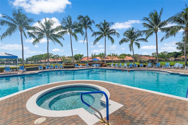 view of swimming pool featuring a community hot tub